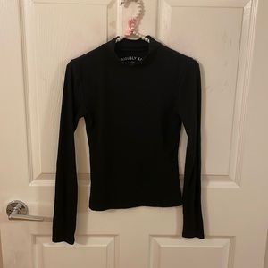 Black skin tight long sleeved shirt